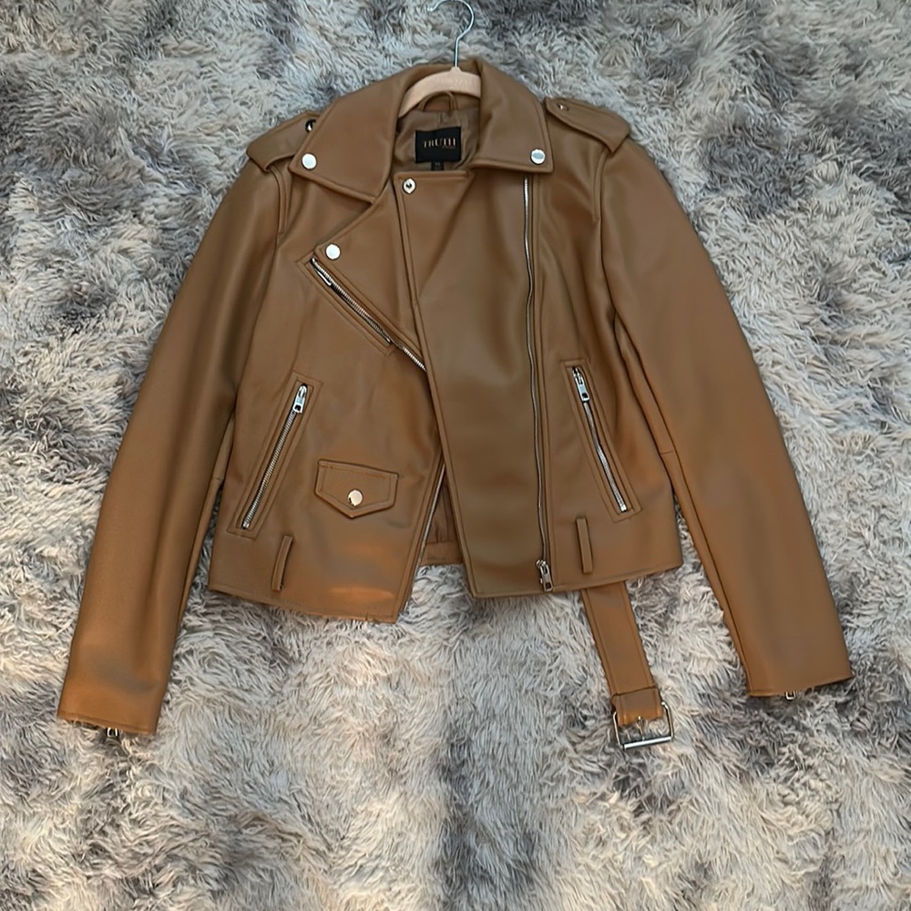 Leather jacket. Tan. New condition. Worn a couple times.